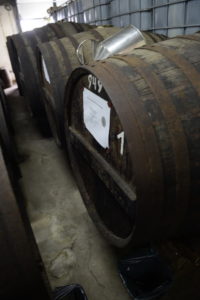 Old wooden rum cask with sampling jug at Abel Fernandes in Madeira